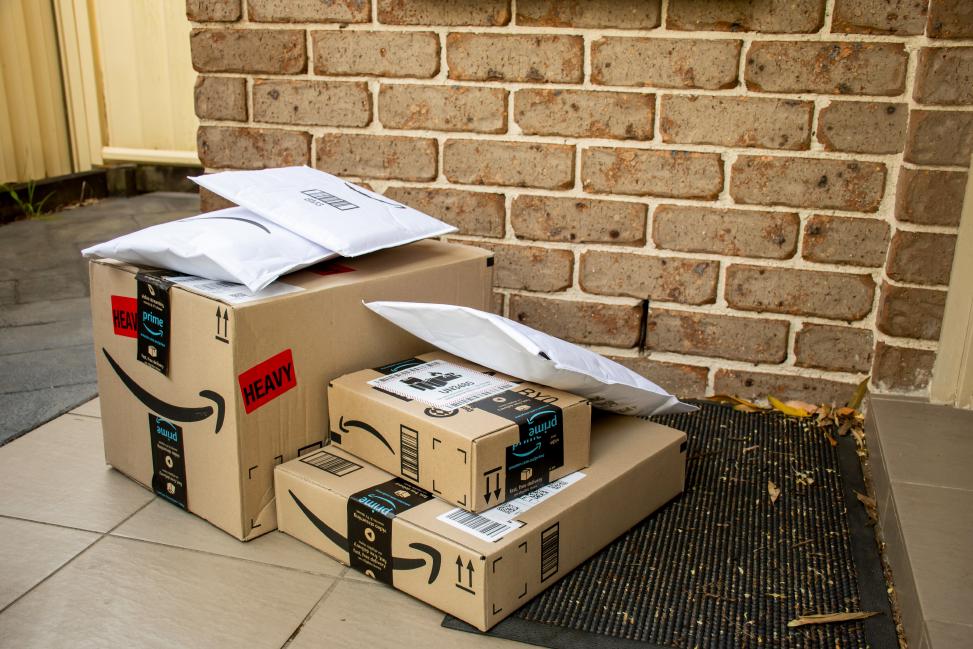 Brushing Attack with Amazon packages Unwanted Amazon packages left behind in front of door of consumers as part of brushing scam.