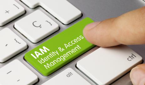 Definition Identity-and-Access-Management Keyboard with a green enter button named IAM Identity & Access Management which is pressed by user.