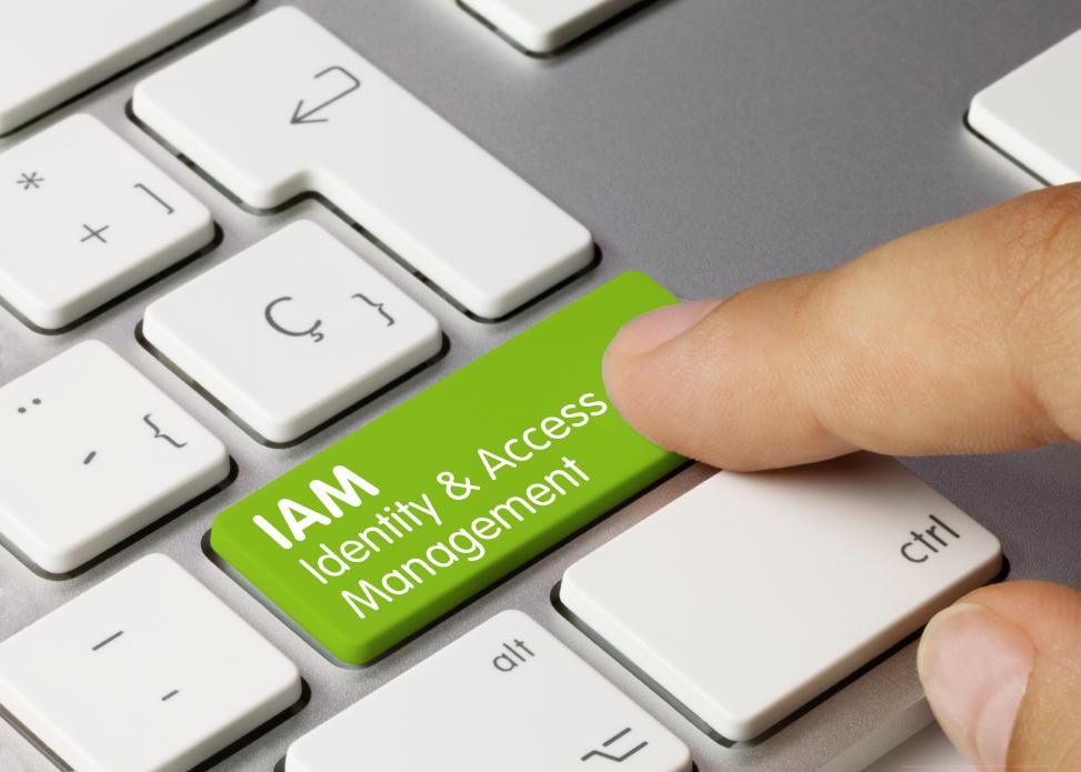 Definition Identity-and-Access-Management Keyboard with a green enter button named IAM Identity & Access Management which is pressed by user.