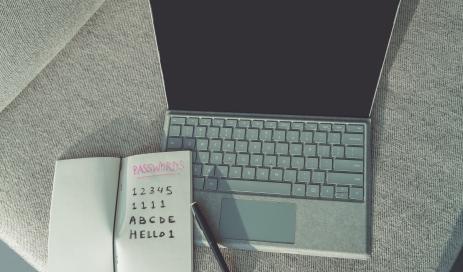 Engity Easy Ensure Strong Password Check at Authentication Several simple passwords written down in paper notebook are lying on top of a notebook and show what a secure password is not looking like.