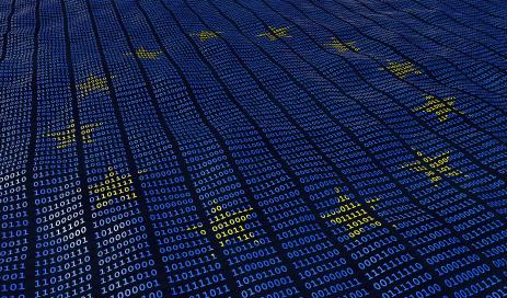 The waving flag of the European Union created from binary code with its twelve golden stars.