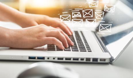 Passwordless Magic Link Login Authentication via E-mail at Engity Notebook with many e-mail icons virtually flying above it symbolizing magic link request sent via e-mail.