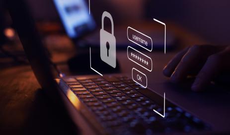 Technical implementation GDPR-compliant A virtual login screen above a keyboard stands for a proper technical implementation of an identity and access management system.