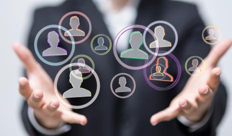 Why user management matters Necessity of an identity and access management system embodied by two hands holding identities in form of circles with anonymous personas inside.